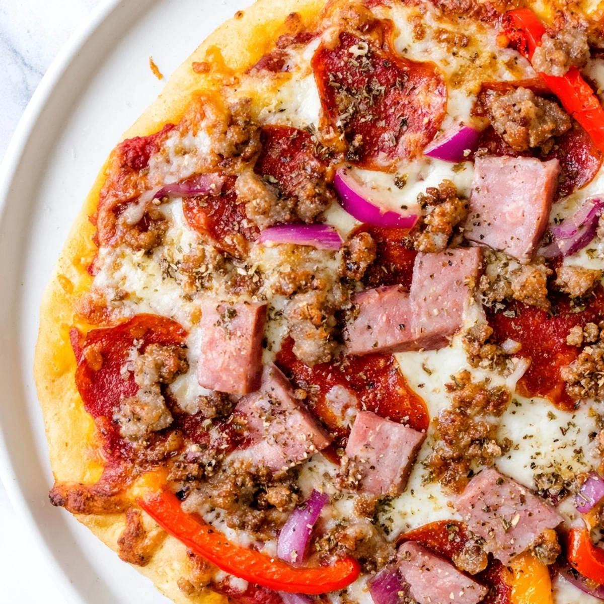 A hearty Meat Lover Pizza with beef toppings, fresh herbs, and a drizzle of garlic oil.