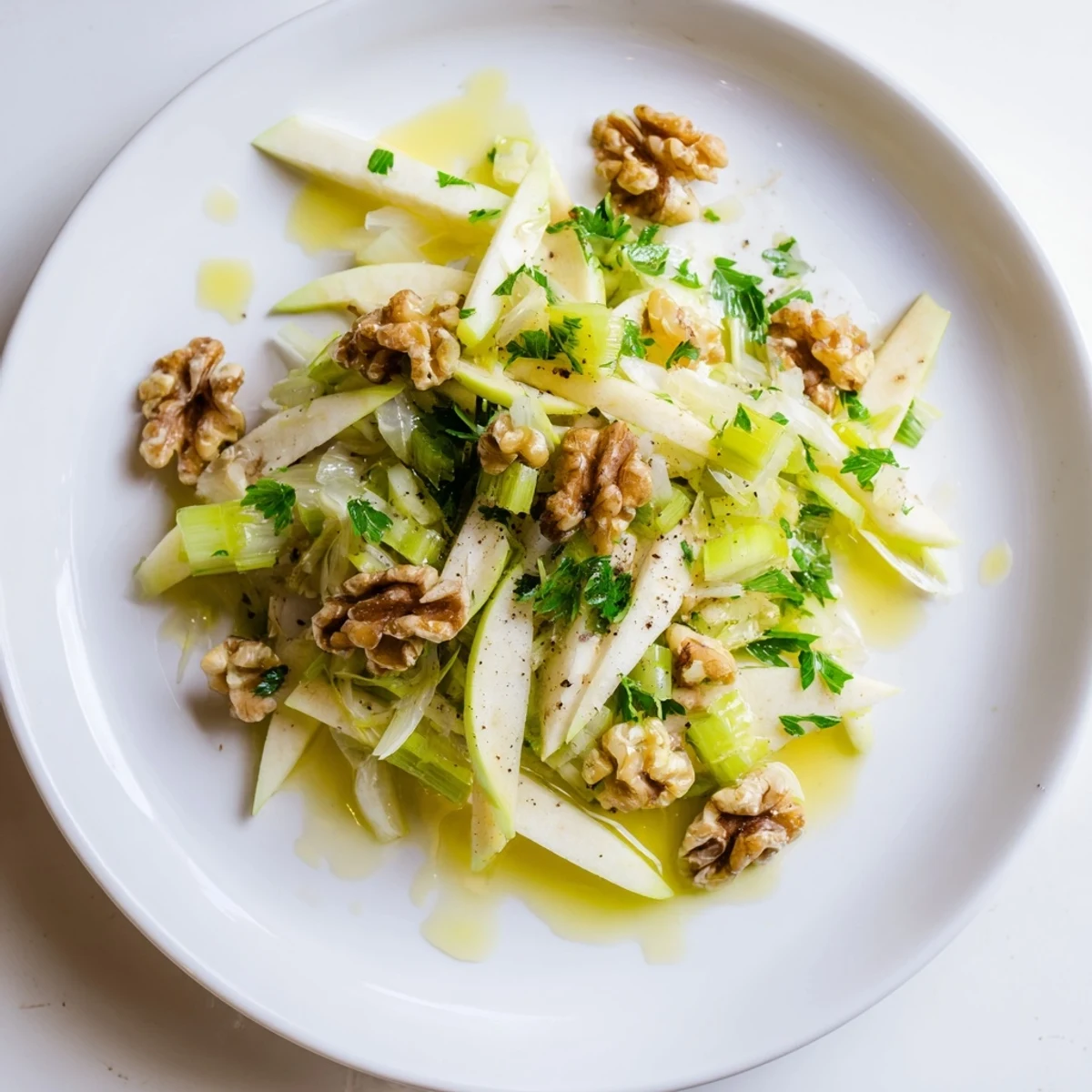 Apple and Celery Salad with Walnuts on a rustic wooden table, featuring sweet apples and toasted nuts, perfect for a quick 15-minute lunch.