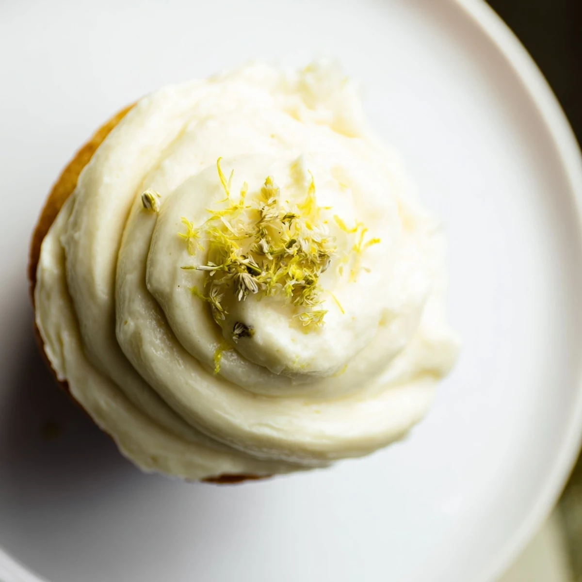 A platter of Elderflower Cupcakes showcases delicate crumb texture and floral garnish, ideal for spring gatherings.