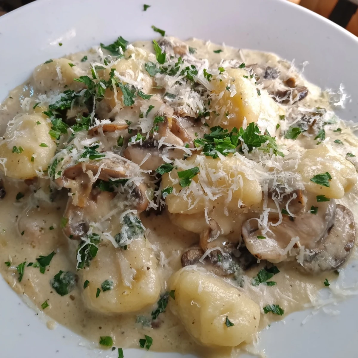 Golden-brown Creamy Mushroom Gnocchi served in a bowl, perfect for a cozy vegetarian dinner.