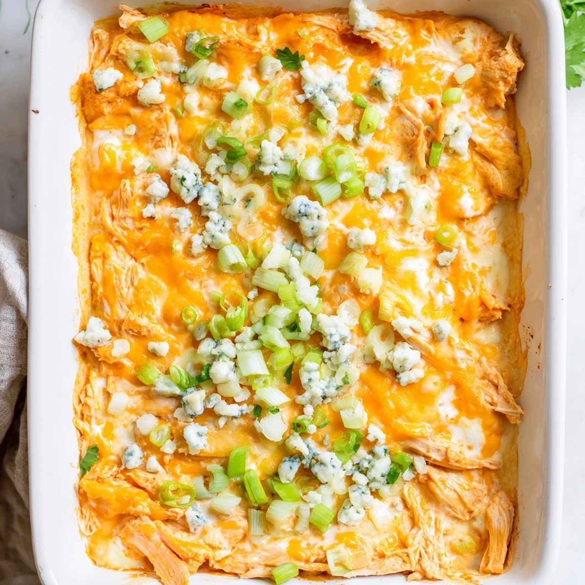 Golden bubbly Buffalo Chicken Cheese Bake fresh from oven with melted cheese topping