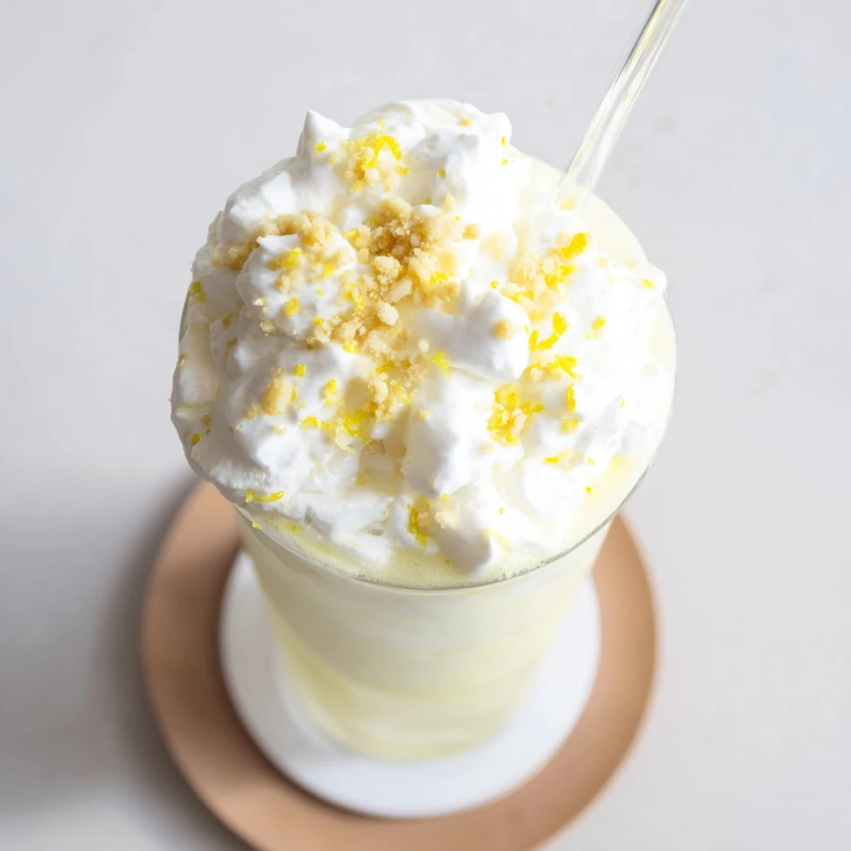 Creamy blended lemon meringue frappé with crushed graham crackers and swirled meringue topping
