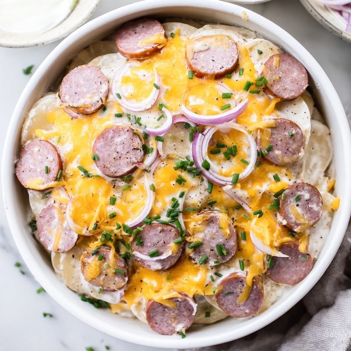 Comforting slow cooker pierogi casserole featuring creamy sauce and browned sausage layers