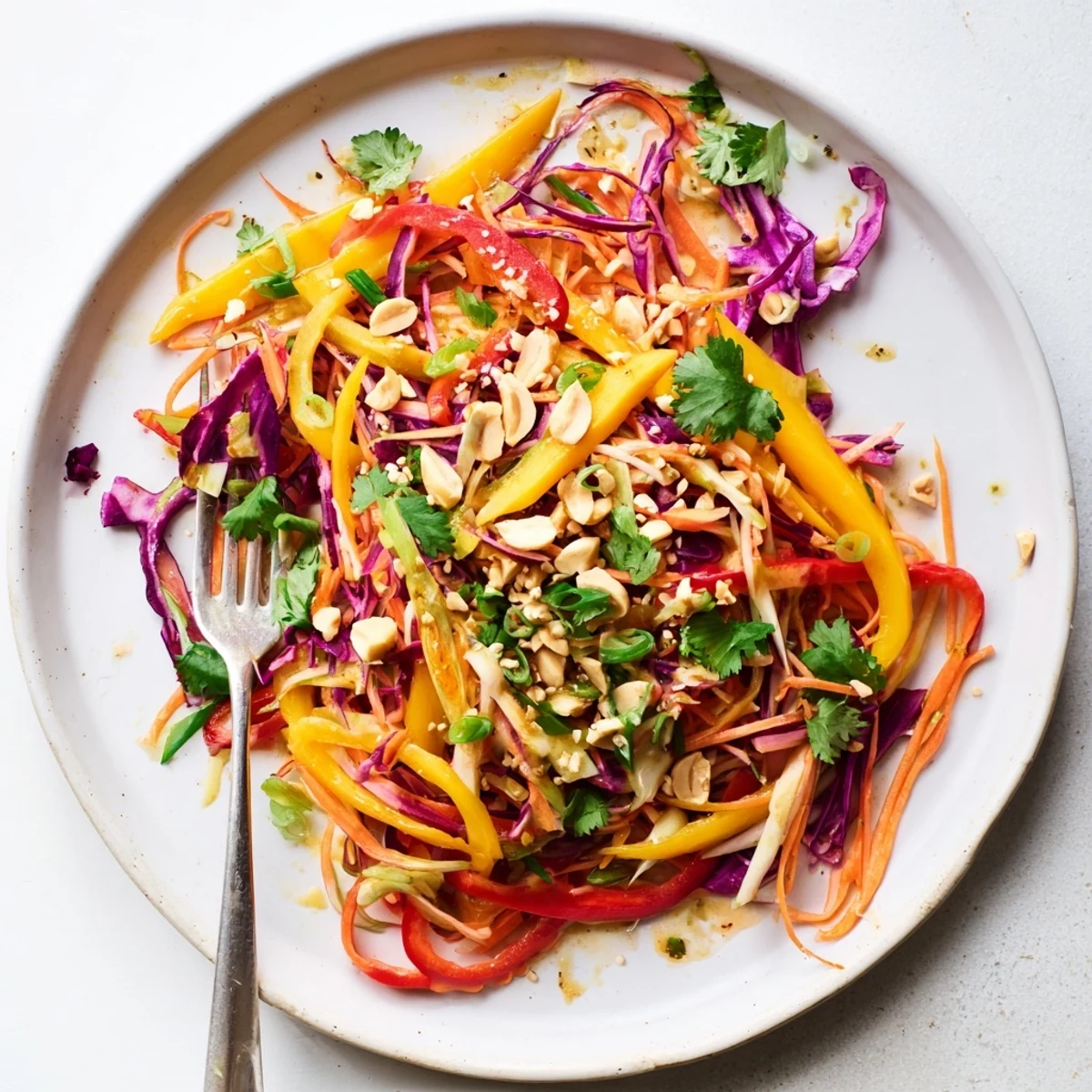 Golden refreshing mango slaw with crisp red cabbage and tangy lime dressing