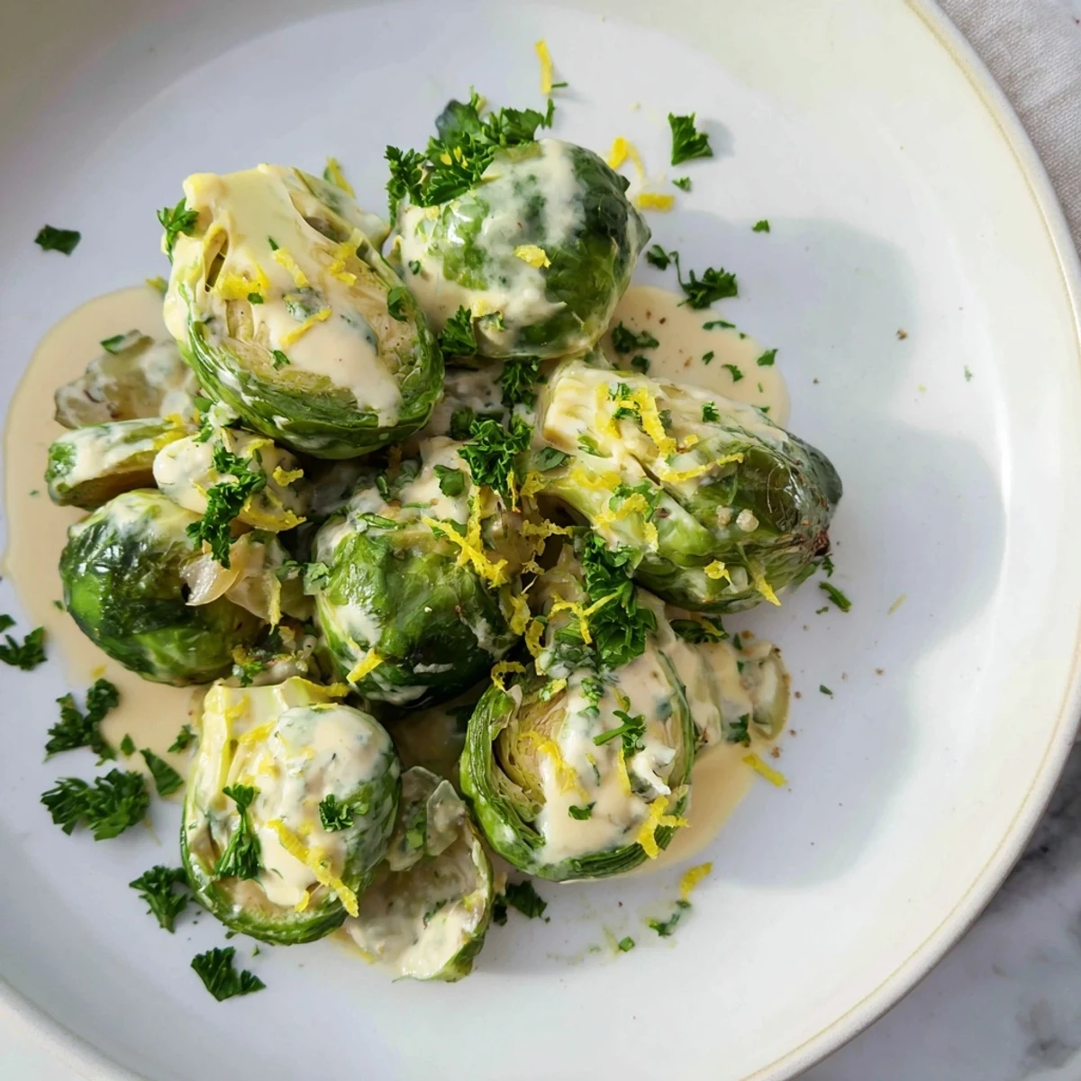 Golden tender Brussels sprouts coated in melted creamy Boursin cheese sauce
