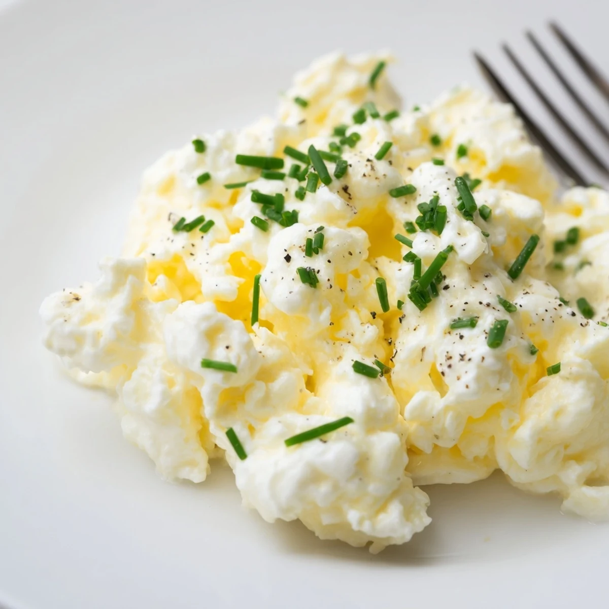 Bright Cottage Cheese Scrambled Eggs with Chives, silky interior, served with rye toast