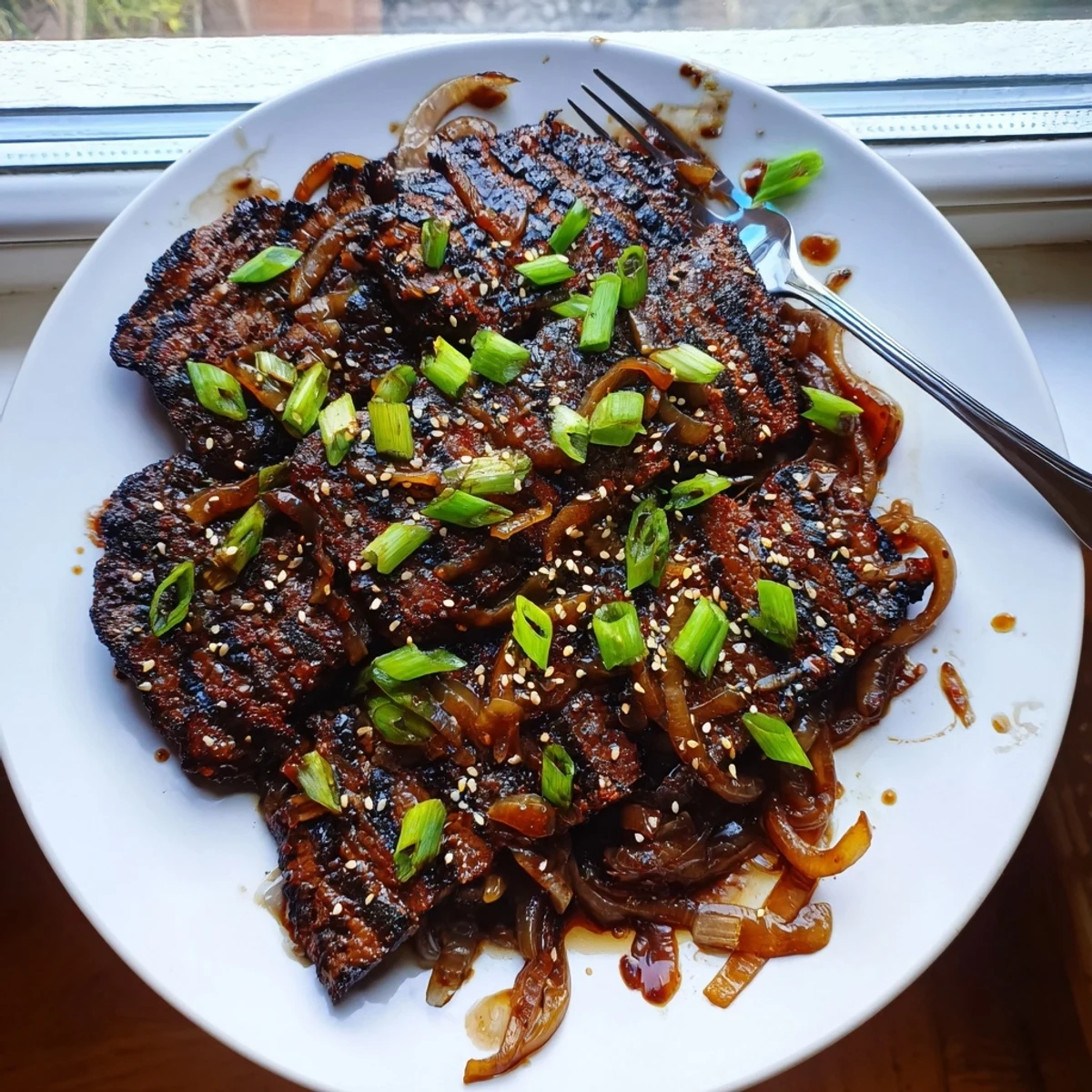 Juicy Asian-inspired cube steak sizzling in a rich oyster sauce over a bed of steamed rice