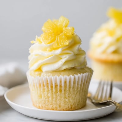 Freshly baked Dole Whip Cupcakes Recipe, golden edges and tropical pineapple aroma